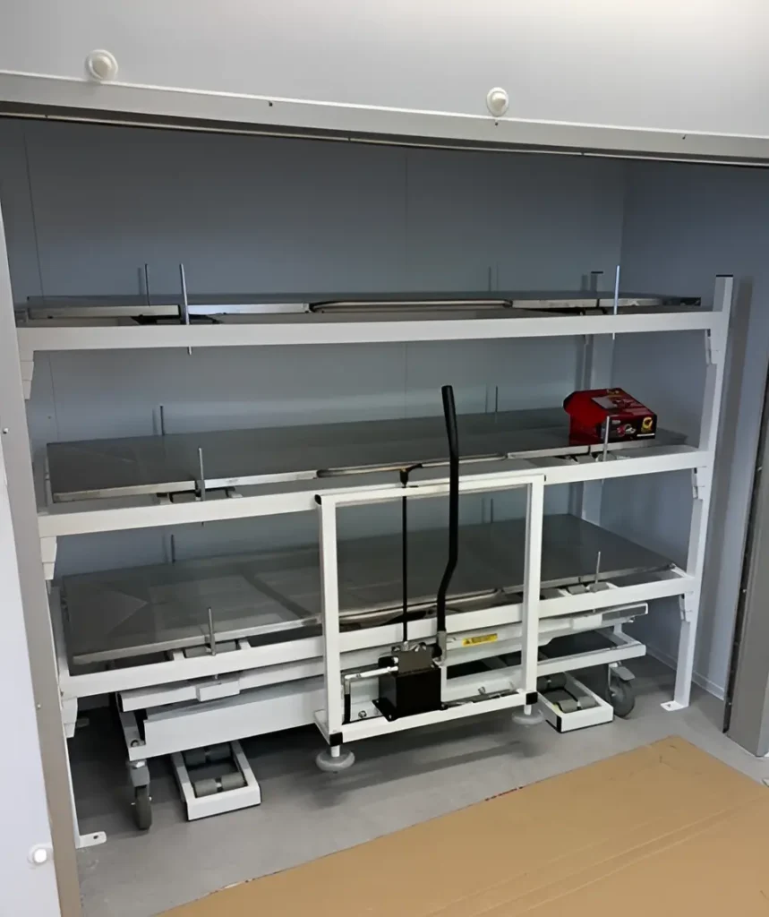 side-loading mortuary with hydraulic trolley stored inside the coldroom
