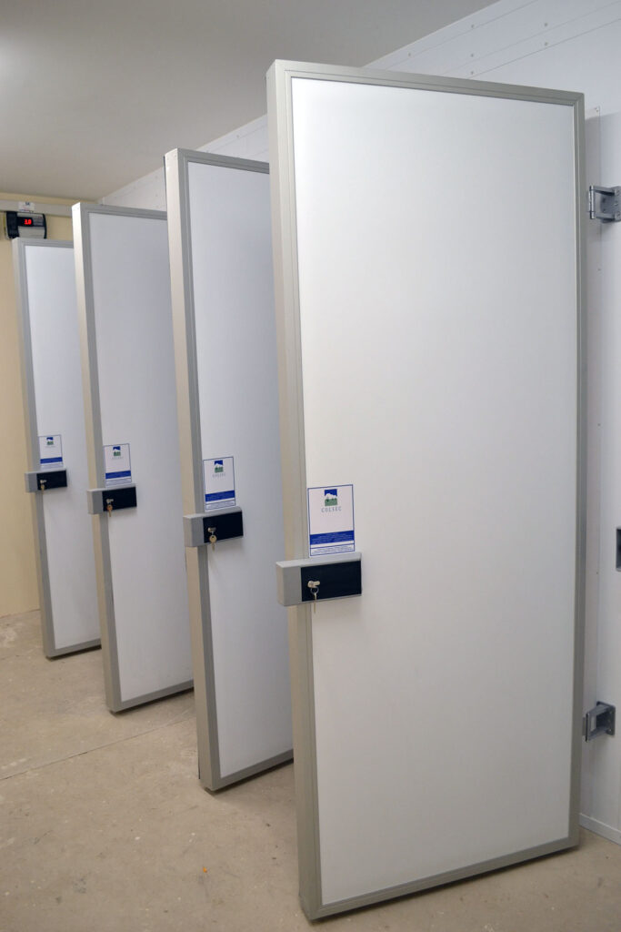 Side view of the open doors of a mortuary coldroom